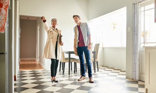 Man spots with realtor spots potential damage in home when house-hunting.