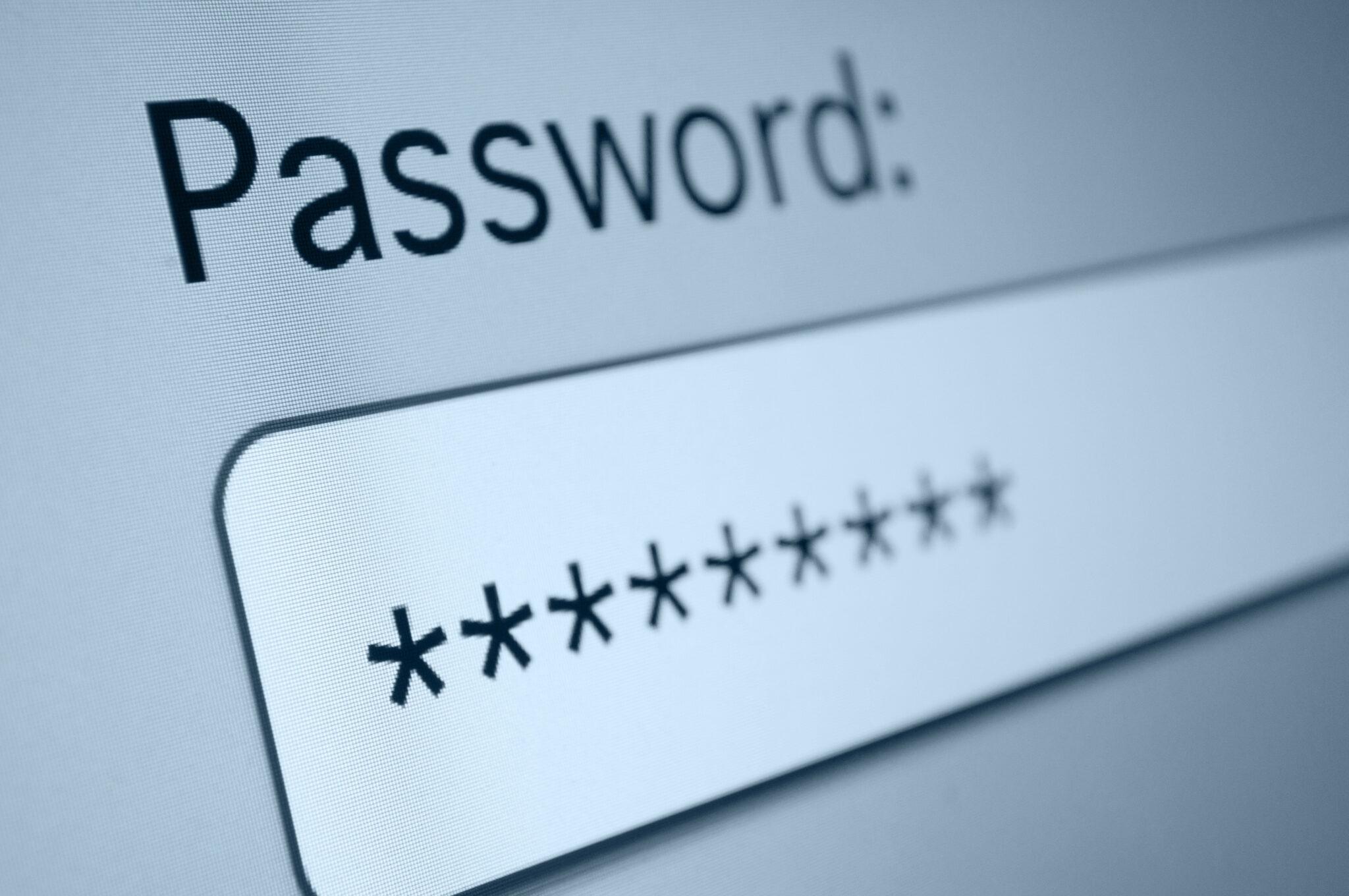 A close-up of a password input field on a screen, showing a series of asterisks masking the password, symbolizing cybersecurity and data protection.