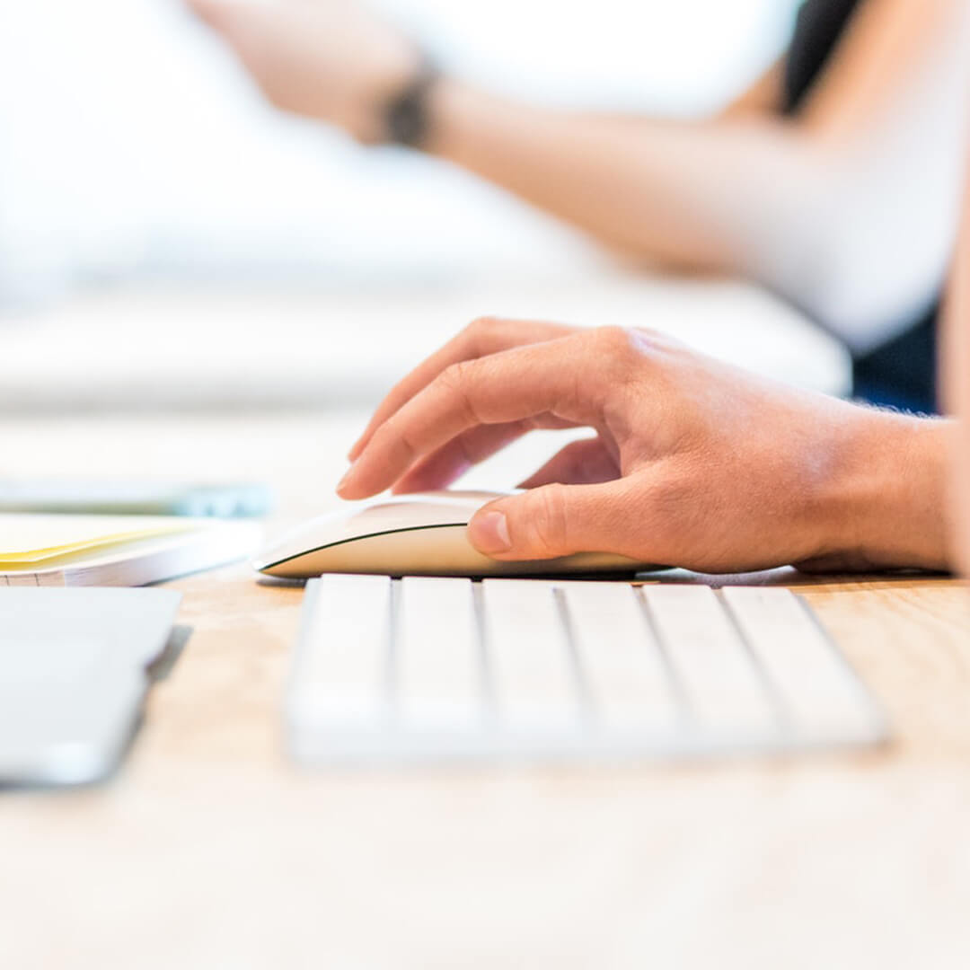Close-up of hand on mouse, investigating an abandoned property list.