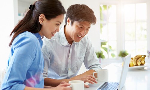 Asian Couple Smiling Finances Learning Hub Small Template