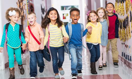 Kids in school hallway, back to school.