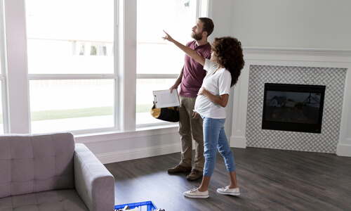 Expectant woman discussing upcoming renovations with a contractor.