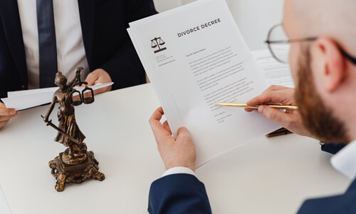 Man reviewing divorce papers.