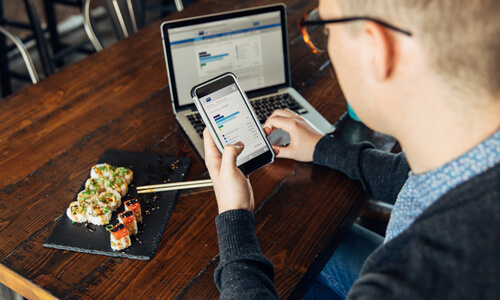 Man overlooks his budget while dining out.