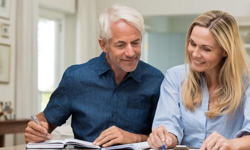 Retired couple creating their budget.