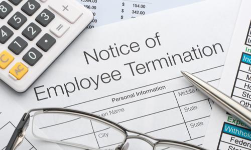 Notice of Employee Termination document on table