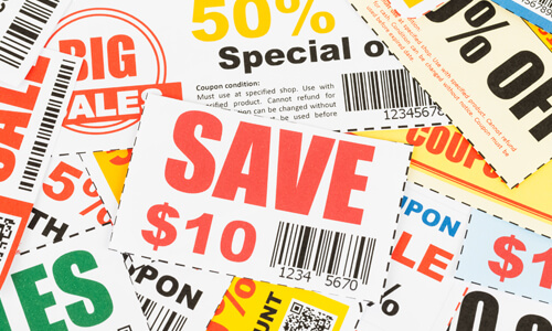 Numerous coupons on table.