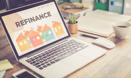 Computer monitor with "Refinance" on the screen.