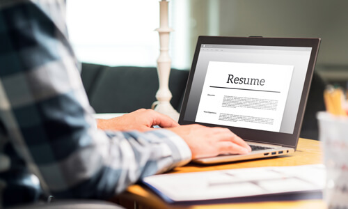 Closeup of computer screen with a job applicant's resume displayed.