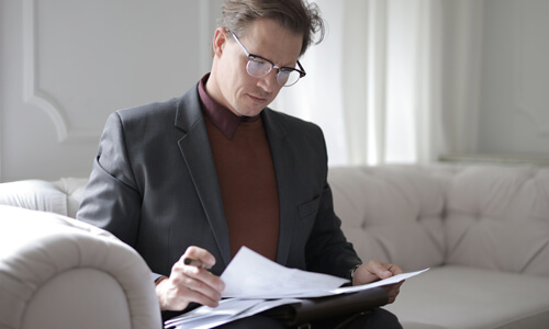 Man filling out his W4 form.