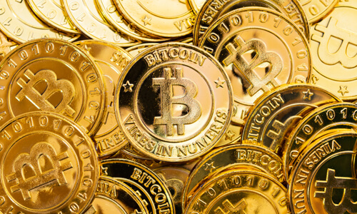 Bitcoin cryptocurrency background. A bunch of golden bitcoin. Digital currency.