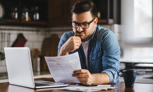 Man struggling with bills wondering if he still needs to save.