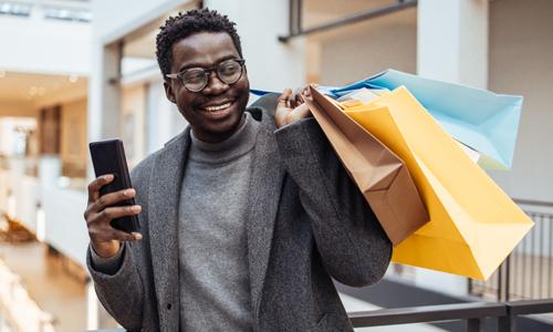 Millennial shopper in mall embracing dupe culture.