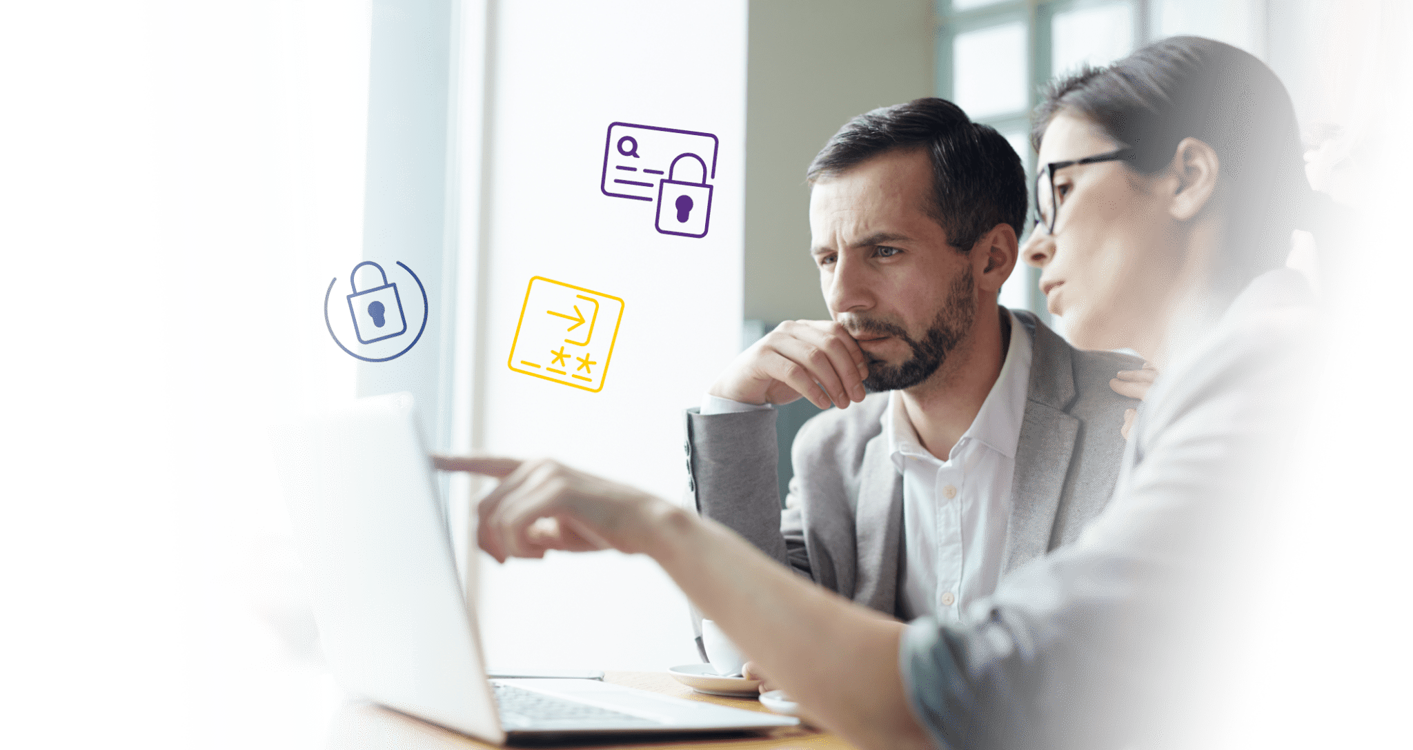 A man an a woman looking at a computer screen together