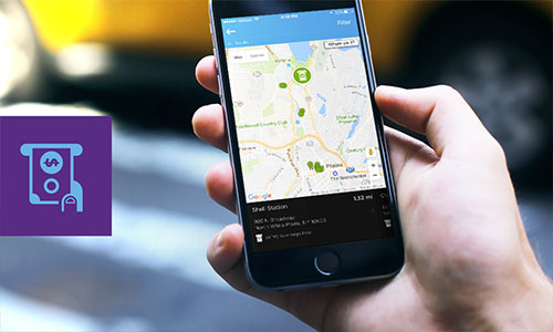 Closeup of hand holding mobile device displaying Quorum's ATM Finder.