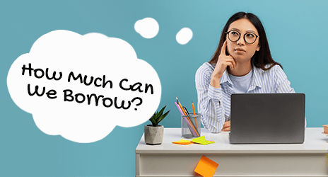 Woman applying for a HELOC at a desk wondering how much she can borrow.